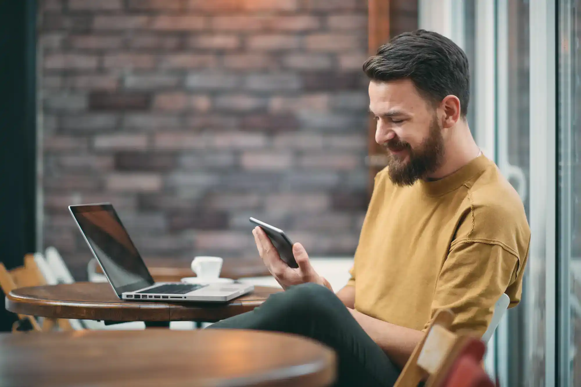 Skymor Panola guy looking at phone smiling