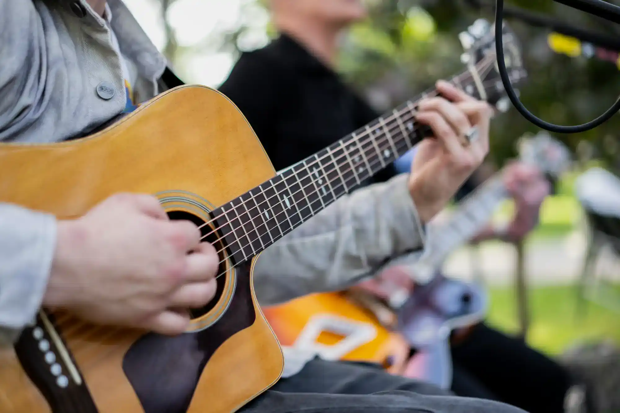 Skymor Panola guy playing acoustic guitar